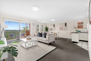 Open-plan living and dining area with balcony outlook at 17/67 Woniora Rd, HURSTVILLE NSW 2220