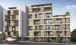 Modern apartment building exterior with balconies and decorative screens at b604/1 Ashton St, Rockdale NSW 2216