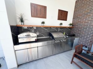 Built-in outdoor barbecue area with stainless steel appliances at 31A Lawrence St, Peakhurst NSW 2210