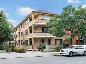Exterior view of a brick apartment building at 6/60 Park Road, Hurstville NSW 2220 with balconies, street frontage, and mature trees