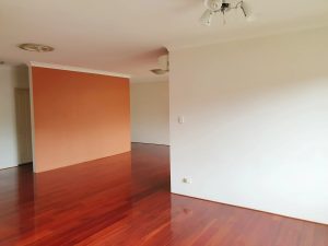 Fresh living room with polished timber floors and a feature wall – 12/75-77 Hudson St, Hurstville NSW 2220 | Noonan Real Estate