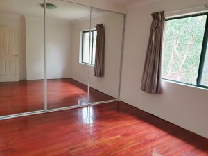 Bedroom with mirrored built-in wardrobe, timber floors and leafy outlook – 12/75-77 Hudson St, Hurstville NSW 2220 | Noonan Real Estate